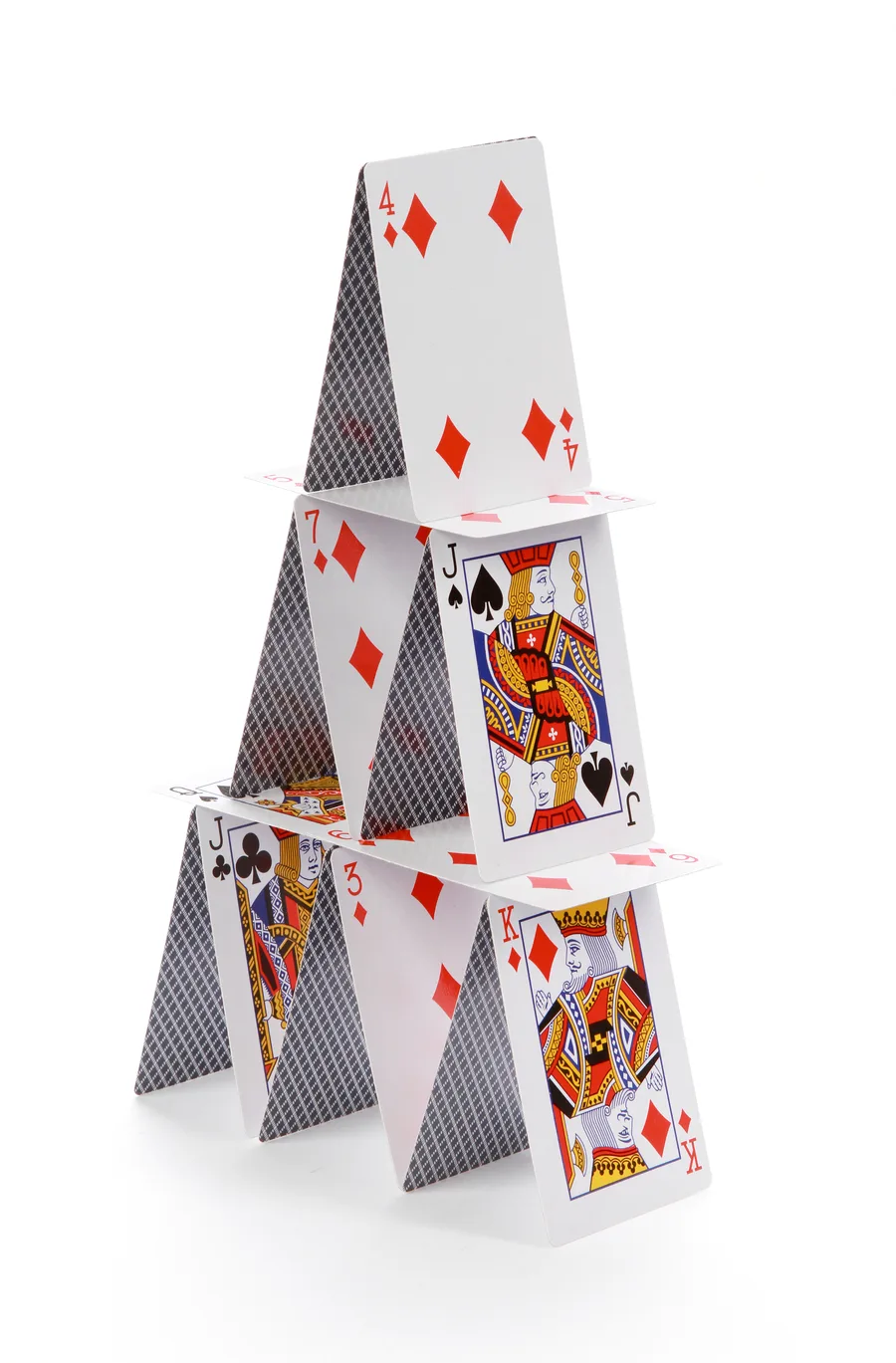 A house of playing cards standing three levels high