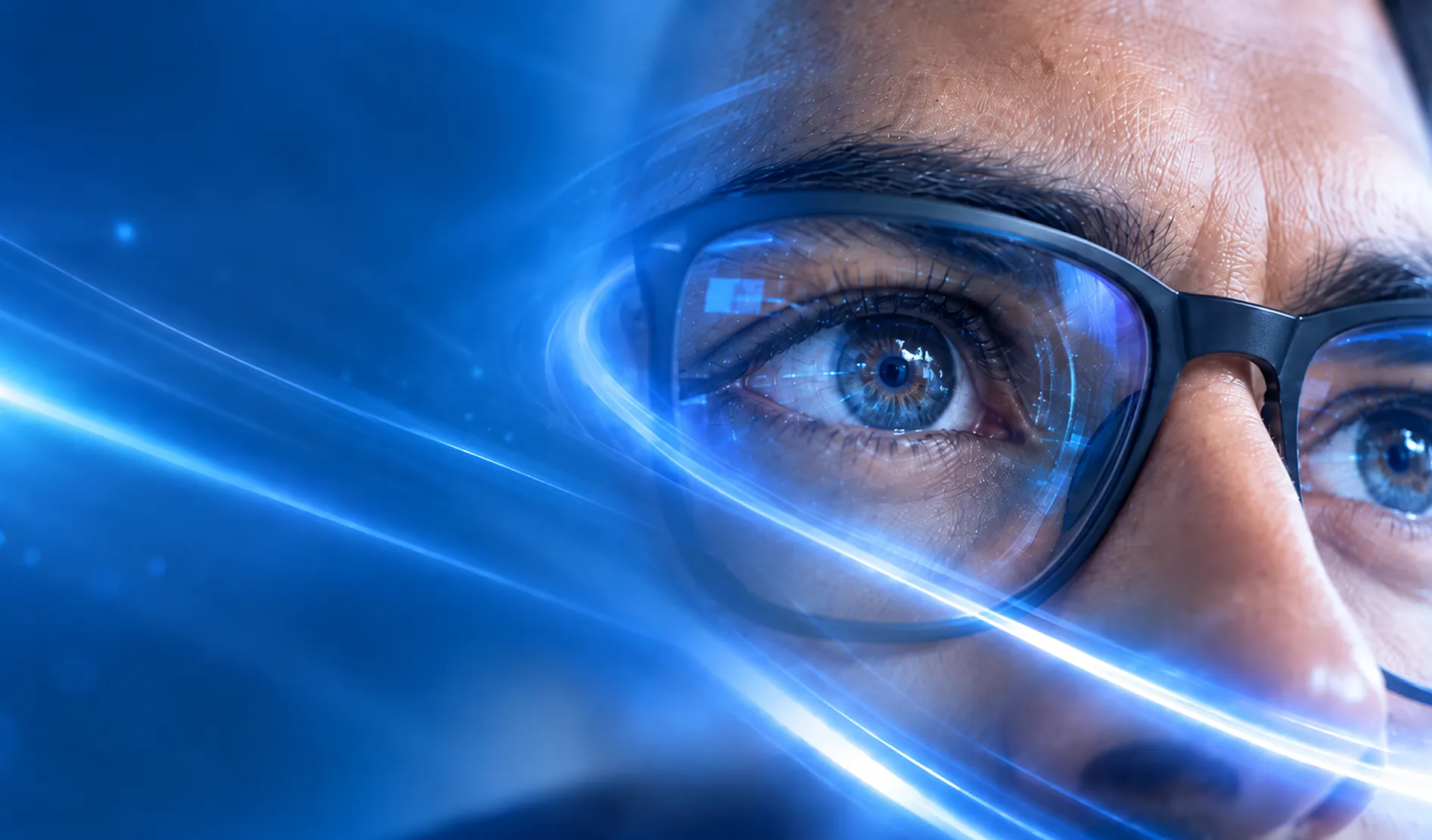 Close-up of a person wearing glasses with streaks of blue digital light
