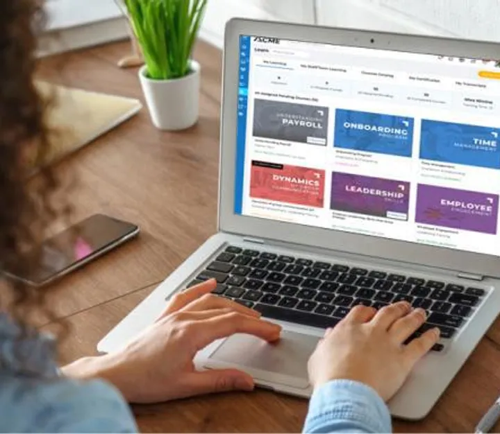 Person using an online learning platform on a laptop