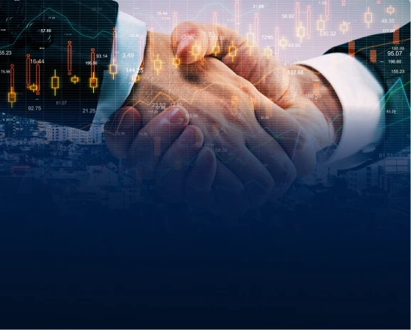Two professionals in suits clasping hands over glowing financial stock charts